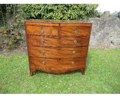 A 19th century mahogany bow fronted chest of drawers, with satinwood cross banding, fitted two short over three long drawers 