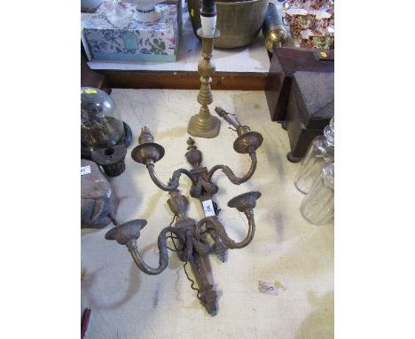 A pair of gilt metal two light wall lights, and a candle stick converted to a lamp base