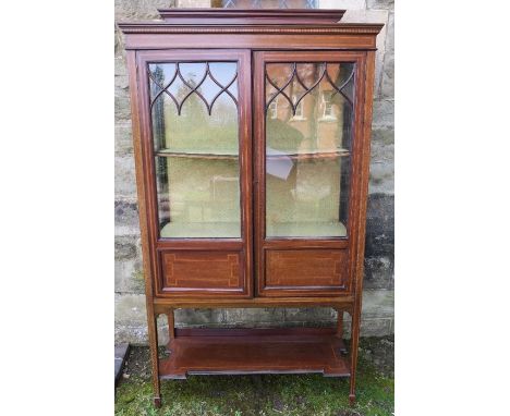 An Edwardian mahogany and inlaid display cabinet, damage to glazing bars, with shelf under, width 36ins, height 70ins, depth 