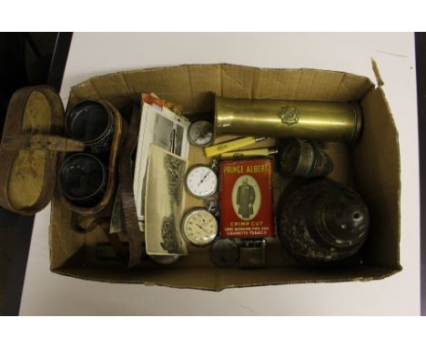 A box of militaria to include a brass shell, a compass and stop-watch, a pair of binoculars, post-cards etc. 