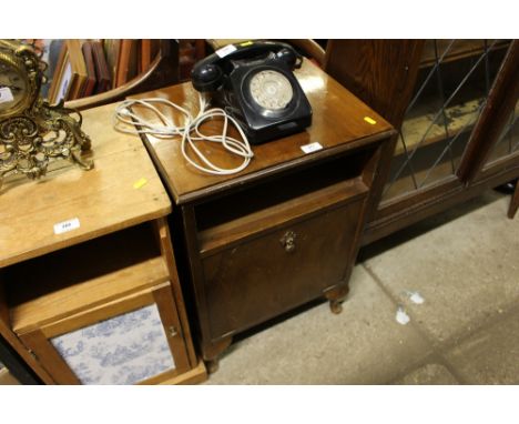 A walnut bedside cabinet 