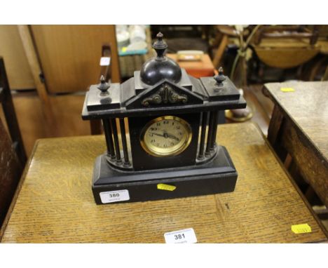 A Victorian style black slate mantel clock of architectural form 