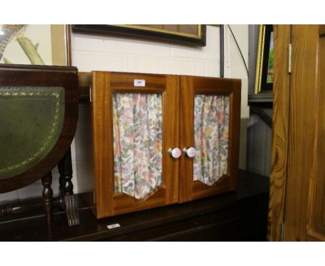 A mahogany and glazed bathroom cabinet 