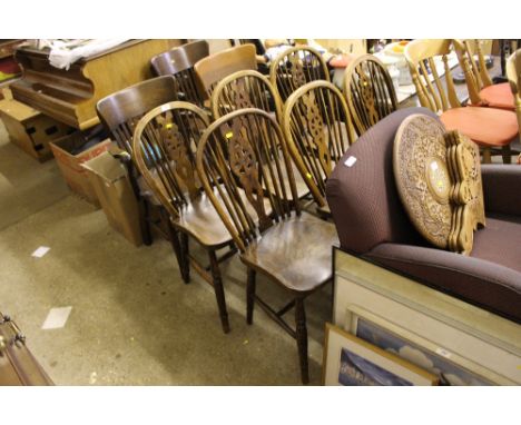 A set of six elm seated stick and wheel back kitchen chairs 