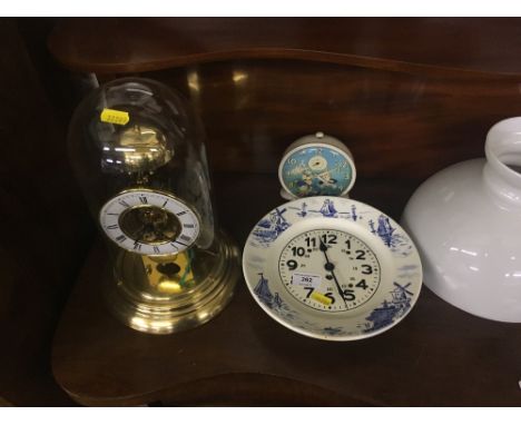 A brass anniversary clock under dome; together with a wall clock; and a Noddy alarm clock 