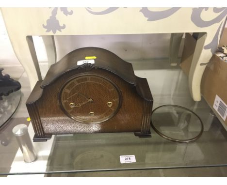 A 1930's oak cased three hole mantel clock 