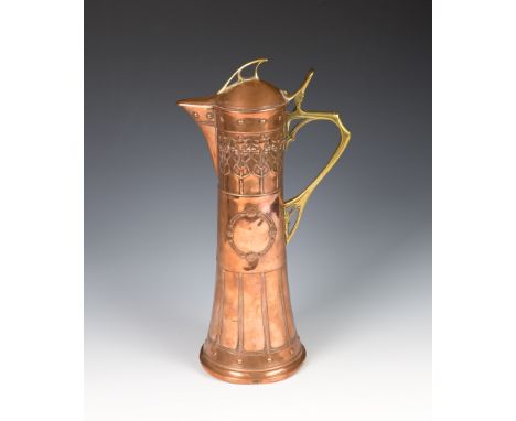 A WMF Art Nouveau copper and brass ewerlate 19th / early 20th century, the tapered cylindrical body decorated with a repeatin