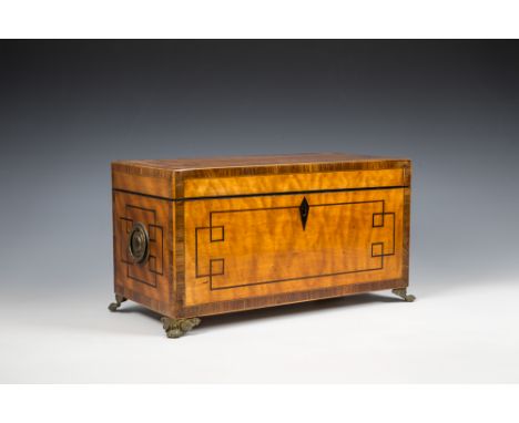 A George III satinwood tea caddyof rectangular form, with circular brass handles to sides, inlaid banding, and geometric ebon