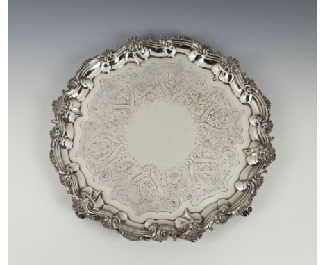 A George III silver salverThomas Chawner, London 1785, with foliate scroll rim, three anthemion and scroll bracket feet, engr
