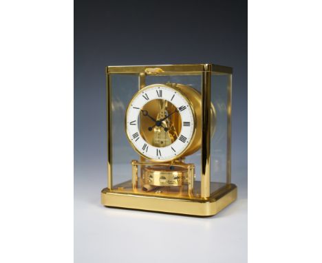 A Jaeger-Le Coultre Atmos clockElysee model, no. 220.107.3, with gilt case, circular open dial with white Roman chapter ring,