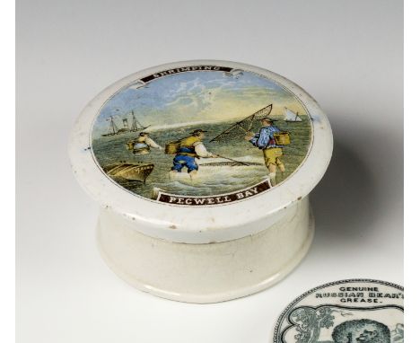 A mid 19th century Prattware pot lid titled 'Shrimping Pegwell Bay'with pictorial scene showing shrimpers on a beach, include