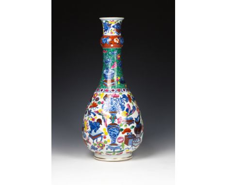 An antique Chinese doucai enamelled porcelain bottle vaseprobably 19th century, the ovoid body with tapering elongated neck w