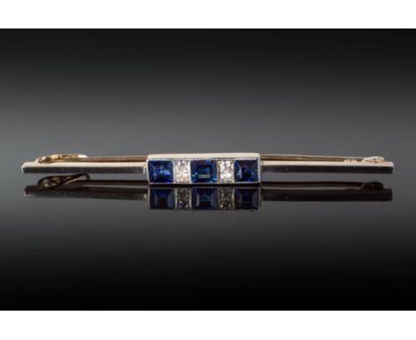 A 14ct gold and platinum, sapphire and diamond Art Deco bar broochset with three square cut sapphires of good colour, divided