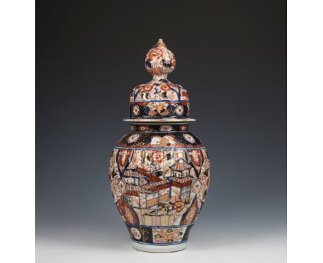 A large Japanese Imari vase and coverlate Meiji period, the ribbed body with domed cover and flower bud finial, decorated wit