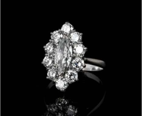 An 18ct white gold and diamond cluster ringhallmarked London 1986, the central approx. 1.5ct marquise cut diamond, colour H, 