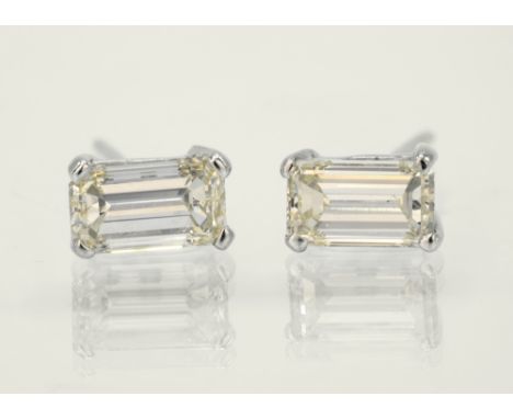 A pair of 18ct white gold and diamond stud earrings the baguette cut diamonds, approx. 0.50ct each, in four claw settings. (2