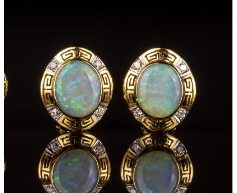 A pair of 18ct yellow gold, opal and diamond cluster earringsthe 12 x 9.5mm. opals within pierced Greek key borders set with 