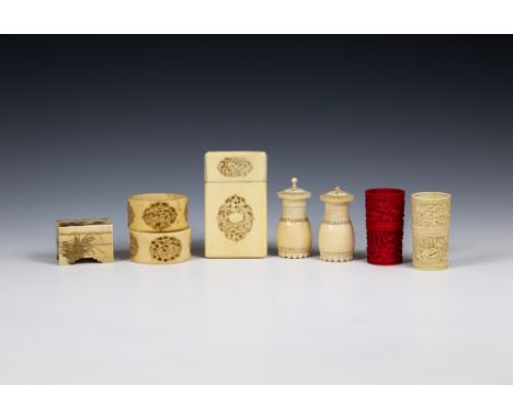 A small collection of Oriental ivory itemsto include a pair of early 20th century Indian carved ivory pepper pots; a Japanese