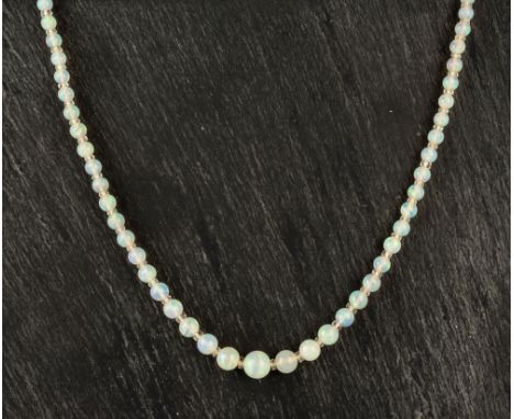 A vintage graduated opal bead necklace1930s, the beads graduating from 2.5mm. to 8mm., with opal set 9ct white gold openwork 