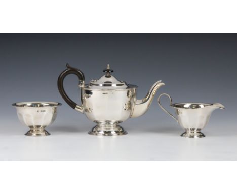 A George V silver three piece tea service Emile Viner (Viners Ltd), Sheffield 1930, comprising teapot, milk jug and sugar bow