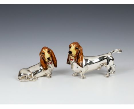 A pair of novelty silver & enamel Basset Hounds Margaret Howell, Sheffield, 1977, one in a sitting pose the other standing, t