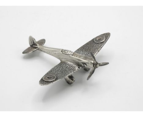 A miniature silver model of a Spitfire marked 925 with import mark & maker's mark CJI, with turning propeller and wheels, 3in