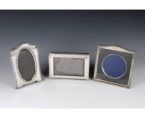 Three silver photo frames two by Henry Moreton, Chester/Birmingham both 1912. together with a further  silver frame of rectan