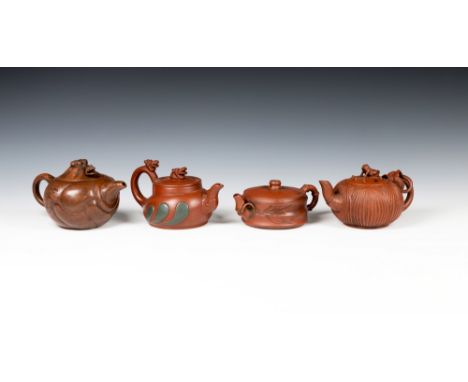 Four Chinese Yixing teapotsone of squat horizontal fluted form with bamboo design handle, the other three of melon form, one 