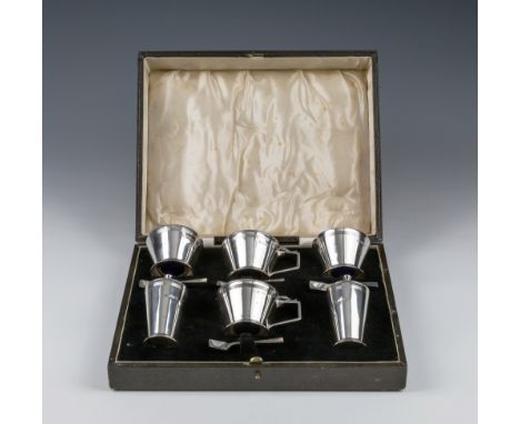 A cased George V silver six piece Art Deco condiment set Barker Brothers Silver Ltd., Birmingham 1935, of tapering circular f