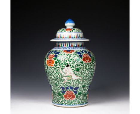 A Chinese wucai decorated porcelain inverted baluster jar and cover, probably Transitional period, c.1650, finely and densely