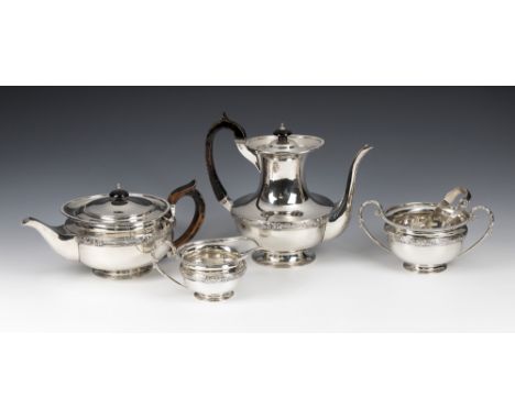 An Edwardian silver four piece tea service Goldsmiths & Silversmiths Co Ltd, London 1909, comprising a teapot, hot water jug,