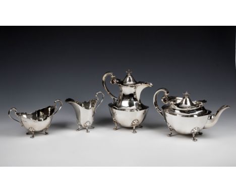 An Edward VIII silver four piece tea service Atkin Brother, Sheffield 1936, panelled form on raised paw feet, comprising teap