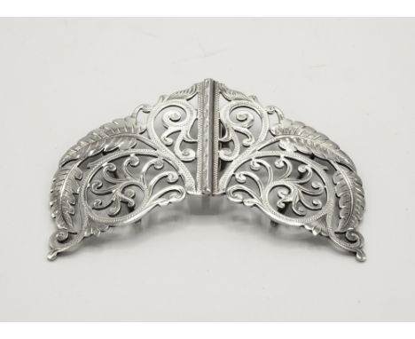 An Edward VII Art Nouveau silver nurse's belt buckle Reynolds & Westwood, Birmingham 1902, the pierced silver buckle with fol