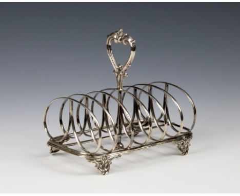 A Victorian silver six division toast rack with Indian horse racing interestWilliam Evans, London 1874, with heart shaped scr