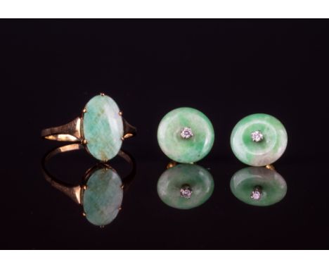 A pair of 18ct yellow gold, diamond and jade stud earringsthe dished, mottled apple green jade discs centred by small, brilli