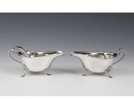 A pair of George V silver sauce boatsHenry Clifford Davis, Birmingham 1933, of George III boat form with cut card rims, 6¼in.