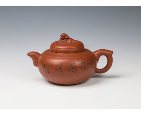 A Chinese Yixing globular teapot and coverthe domed cover with Shi-Shi dog finial, the main body decorated with foliage and c