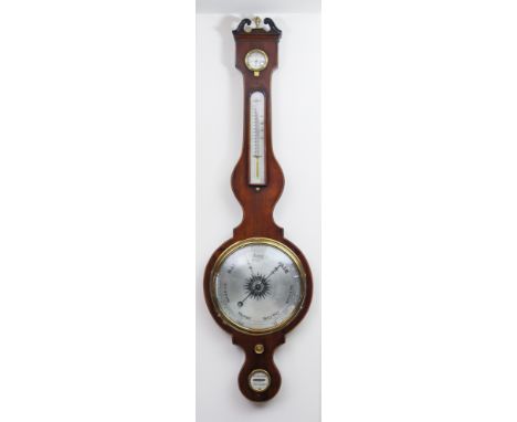 An early 19th century mahogany wheel barometerof large proportions, the 9in. silvered dial signed 'M. Andrews Warranted', 42i