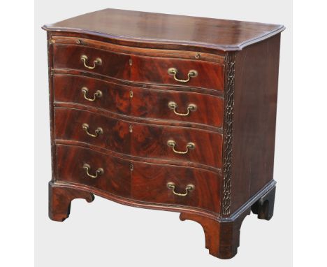 A Victorian mahogany serpentine chest of drawers in the Georgian mannerthe moulded top with serpentine sides and front, over 