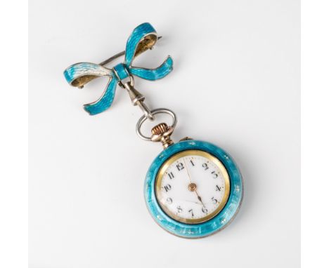 An Edwardian silver gilt and enamel brooch watch import marks for London 1910, the light blue guilloche case with silver fleu