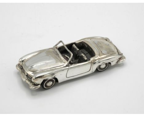 A miniature sterling silver Mercedes-Benz 190SL sports car c.1990 by Harrison Brothers & Howson Ltd, London, with moving whee