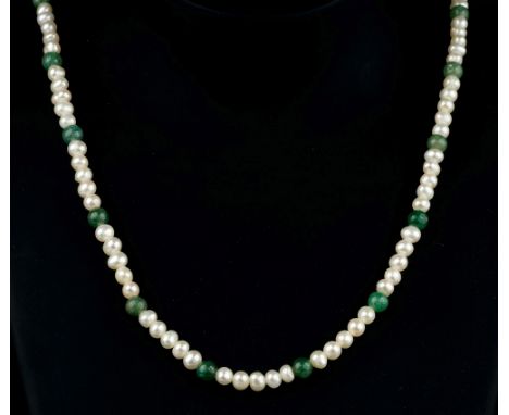 A 1920s-30s seed pearl and jade style necklacethe single stand of 3-4mm. seed pearls spaced at intervals with green jade styl
