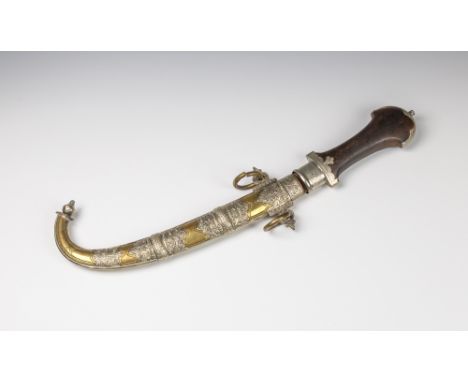 A Persian jambiyaprobably late 19th / early 20th century, waisted wooden grip with silver chased mount and curved blade, the 