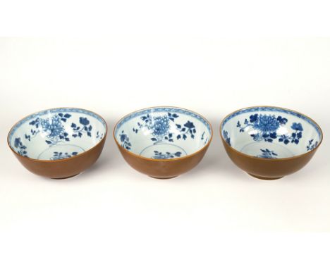 Three Chinese blue and white porcelain Batavian bowls from The Nanking Cargo, Qianlong period, c.1750, painted with peonies a