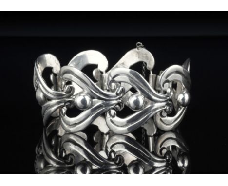 A Mexican sterling silver Art Nouveau style bracelet by Taxco Silver, with stylised floral and bead links.* Condition: In ver