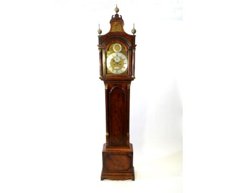 A late George III mahogany longcase clock, the arched pagoda top with three ball and spire gilt brass finials and blind fretw