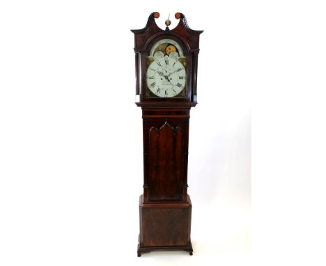 A Regency mahogany longcase clock, the broken scroll swan neck pediment centred by a ball and spire finial above an arched gl