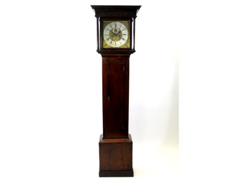 An oak longcase clock, mid-18th century, the dentil moulded ogive cornice above a blind fret work frieze and square glazed do