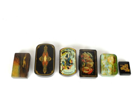 A papier mache snuff box depicting racing greyhounds, 8.5cm wide, together with a further papier mache example depicting a se