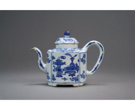 A Chinese blue and white teapot Kangxi Of lobed oval form with plain loop handle and domed cover, raised on four pad feet, de